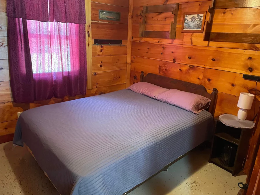 Fox Cabin full sized bed Pine Cone Acres Rustic Cabin Rental Solon Maine